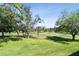 Scenic view of the golf course, surrounded by lush trees, providing a tranquil and picturesque backdrop at 36750 Us 19 N # 22212, Palm Harbor, FL 34684