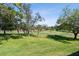 Scenic view of the golf course, surrounded by lush trees, providing a tranquil and picturesque backdrop at 36750 Us 19 N # 22212, Palm Harbor, FL 34684