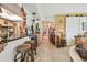 Kitchen with bar top with modern pendant lighting and stools at 36750 Us 19 N # 22212, Palm Harbor, FL 34684