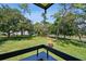 A scenic view of green grass and trees from a balcony at 36750 Us 19 N # 22212, Palm Harbor, FL 34684