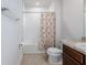 Clean bathroom featuring a shower/tub combo, toilet, and vanity with granite countertop at 3686 Zephyr Preserve Pl, Zephyrhills, FL 33541
