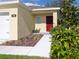 Charming home exterior with manicured landscaping, a walkway to the front door, and a two-car garage at 3686 Zephyr Preserve Pl, Zephyrhills, FL 33541