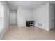 Hallway view with tile floors, a dark desk, and a white door, showcasing the home's interior design at 3686 Zephyr Preserve Pl, Zephyrhills, FL 33541