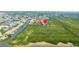 High angle shot shows the condo complex bordering a wetland area with access to an elevated boardwalk at 4302 Bayside Village Dr # 102, Tampa, FL 33615