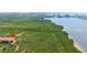 Elevated view features a waterfront condo complex, adjacent to a natural wetland with a long boardwalk at 4302 Bayside Village Dr # 102, Tampa, FL 33615