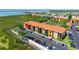Stunning aerial view of the condo complex with lush surroundings, showcasing its prime waterfront location at 4302 Bayside Village Dr # 102, Tampa, FL 33615