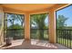 Screened balcony overlooking greenery, providing a private outdoor space at 4302 Bayside Village Dr # 102, Tampa, FL 33615