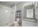 Bathroom featuring a shower and granite vanity at 4302 Bayside Village Dr # 102, Tampa, FL 33615