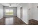 Bright bedroom with wood-look floors, fan and closet at 4302 Bayside Village Dr # 102, Tampa, FL 33615