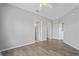 Bedroom featuring wood floors and neutral walls at 4302 Bayside Village Dr # 102, Tampa, FL 33615