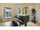Clubhouse interior featuring piano with natural light at 4302 Bayside Village Dr # 102, Tampa, FL 33615