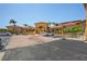 Clubhouse exterior with porte cochere, landscaping, and covered entry at 4302 Bayside Village Dr # 102, Tampa, FL 33615
