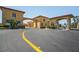 Community entrance with gatehouse and manicured landscaping at 4302 Bayside Village Dr # 102, Tampa, FL 33615