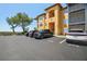 Well-maintained condo exterior with dedicated parking spaces and lush landscaping, offering a welcoming curb appeal at 4302 Bayside Village Dr # 102, Tampa, FL 33615