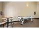 Fun-filled game room featuring air hockey, dart board, and comfortable seating area at 4302 Bayside Village Dr # 102, Tampa, FL 33615