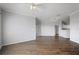 Spacious living room with crown molding, hardwood floors, and natural light, seamlessly connected to the kitchen at 4302 Bayside Village Dr # 102, Tampa, FL 33615