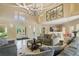 Inviting lobby area featuring elegant chandelier, comfortable seating, and bright entryways at 4302 Bayside Village Dr # 102, Tampa, FL 33615
