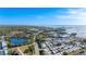Panoramic aerial view of a coastal community with waterways and lush greenery under a blue sky at 455 Alt 19 # 111, Palm Harbor, FL 34683