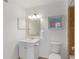 Clean bathroom features a vanity, framed mirror, and toilet at 455 Alt 19 # 111, Palm Harbor, FL 34683