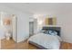 Comfortable bedroom with ensuite bath, closet, and attractive decor at 455 Alt 19 # 111, Palm Harbor, FL 34683