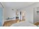 Bright bedroom with access to the kitchen, bathroom and outdoor balcony at 455 Alt 19 # 111, Palm Harbor, FL 34683