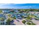 Beautiful condo community featuring bright buildings, lush landscaping, and ample parking at 455 Alt 19 # 111, Palm Harbor, FL 34683