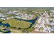 Aerial shot of a waterfront community, highlighting the waterways and lush landscaping at 455 Alt 19 # 111, Palm Harbor, FL 34683