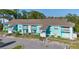 Attractive two story condo complex featuring private balconies, walkways, and stairs at 455 Alt 19 # 111, Palm Harbor, FL 34683