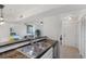 Bright kitchen featuring granite countertops and a stainless steel sink at 455 Alt 19 # 111, Palm Harbor, FL 34683