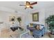 Cozy living room featuring a modern sofa, glass coffee table, and adjacent dining area with natural light at 455 Alt 19 # 111, Palm Harbor, FL 34683