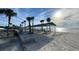 Beautiful beach area with picnic tables under a covered pavilion, and nearby parking for convenient access at 4551 Floramar Ter, New Port Richey, FL 34652