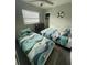 Comfortable bedroom with two twin beds and a nautical theme at 4551 Floramar Ter, New Port Richey, FL 34652