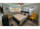 Cozy bedroom with two side tables and beach themed bedspread at 4551 Floramar Ter, New Port Richey, FL 34652