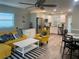 Bright, open-concept living area adjoining a modern kitchen and dining space with stylish decor at 4551 Floramar Ter, New Port Richey, FL 34652