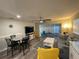 Open living room with dining area, comfortable seating, and natural light at 4551 Floramar Ter, New Port Richey, FL 34652