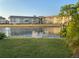 Scenic view of the water from the property, showcasing the dock and building exteriors at 4551 Floramar Ter, New Port Richey, FL 34652