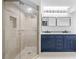 Beautifully renovated bathroom features a glass shower, and a double sink vanity at 5482 Salem Square N Dr, Palm Harbor, FL 34685