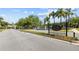 View of the Devonshire neighborhood entrance, showcasing manicured landscaping and a decorative fountain at 5482 Salem Square N Dr, Palm Harbor, FL 34685