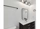 Bathroom with a vanity, mirror, and modern lighting fixtures at 6315 S Richard Ave, Tampa, FL 33616