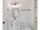 Bright bathroom with white cabinets, and a sleek black framed mirror at 6315 S Richard Ave, Tampa, FL 33616