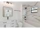 Beautiful bathroom with modern fixtures, marble tile, and a new bathtub at 6315 S Richard Ave, Tampa, FL 33616