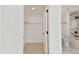 View into bathroom highlighting marble tile work from an attached closet space at 6315 S Richard Ave, Tampa, FL 33616