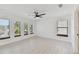 Bright bedroom featuring hardwood floors and four windows at 6315 S Richard Ave, Tampa, FL 33616