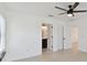Bedroom with hardwood floors leads to a closet, bathroom, and another room at 6315 S Richard Ave, Tampa, FL 33616