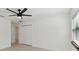 Well-lit bedroom featuring a ceiling fan, closet, and hardwood floors at 6315 S Richard Ave, Tampa, FL 33616