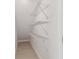 A closet features three white wire rack shelves, providing ample storage space at 6315 S Richard Ave, Tampa, FL 33616