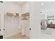 Walk-in closet offers ample storage with built-in shelving and hanging space at 6315 S Richard Ave, Tampa, FL 33616