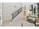 Modern entryway with staircase, decor, neutral rug and engineered hardwood flooring at 6315 S Richard Ave, Tampa, FL 33616