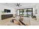 Bright living room featuring modern furnishings, large sliding glass doors and a ceiling fan at 6315 S Richard Ave, Tampa, FL 33616