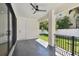 Covered patio with ceiling fan and backyard view at 6315 S Richard Ave, Tampa, FL 33616